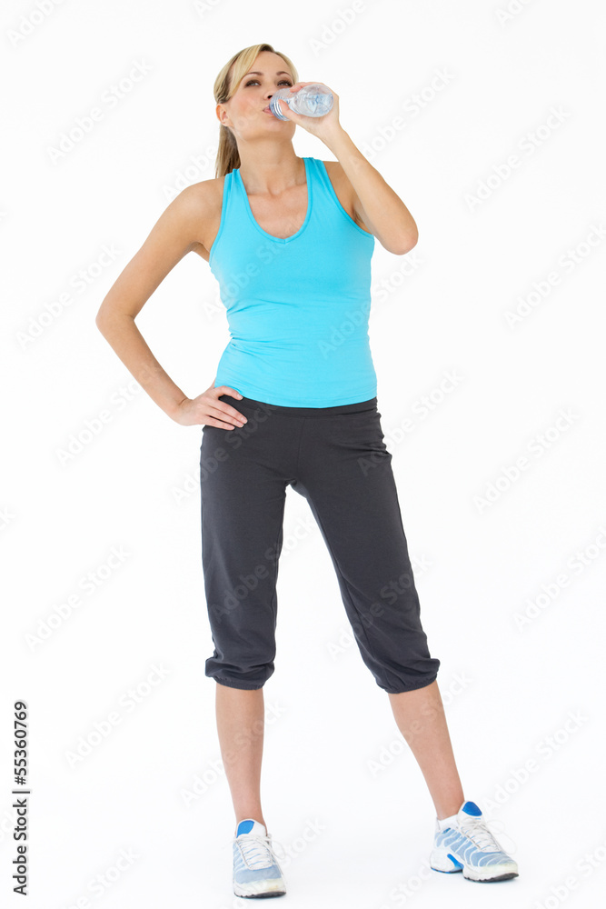 Studio Shot Of Exercising Woman Drinking Water Studio Shot Of Exercising Woman Drinking Water