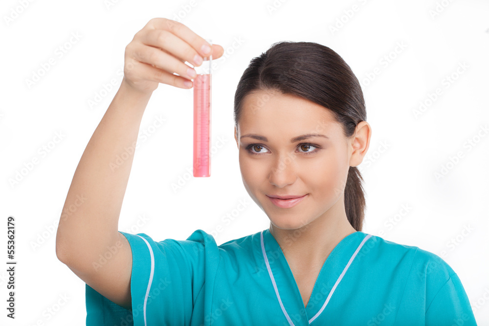 Chemical experiment. Confident young woman in lab coat holding a Chemical experiment. Confident young woman in lab coat holding a