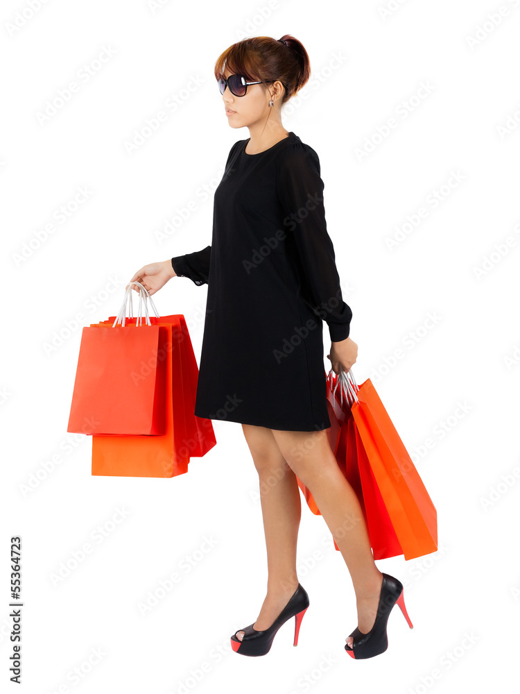 Young asian woman carries shopping bags