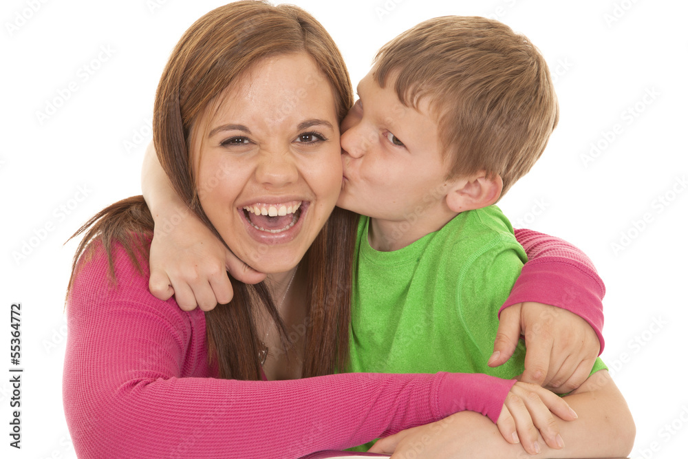 Girl and young boy kiss her laugh