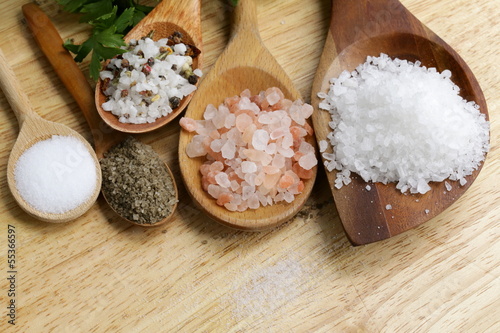 different types of salt (pink, sea, black, and with spices) photo