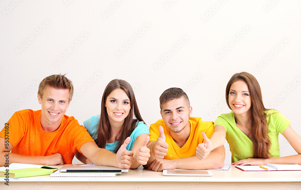 Group of young students sitting in the room Group of young students sitting in the room