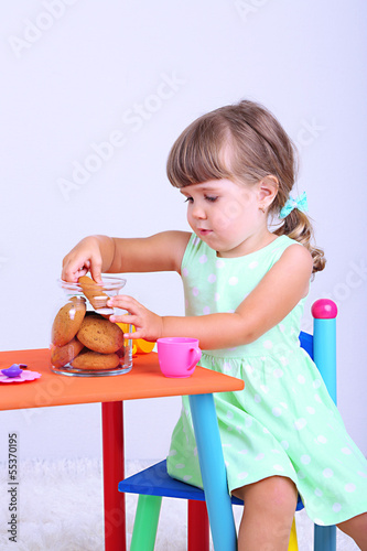 Little cute girl sitting