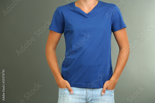 T-shirt on young man, on grey background
