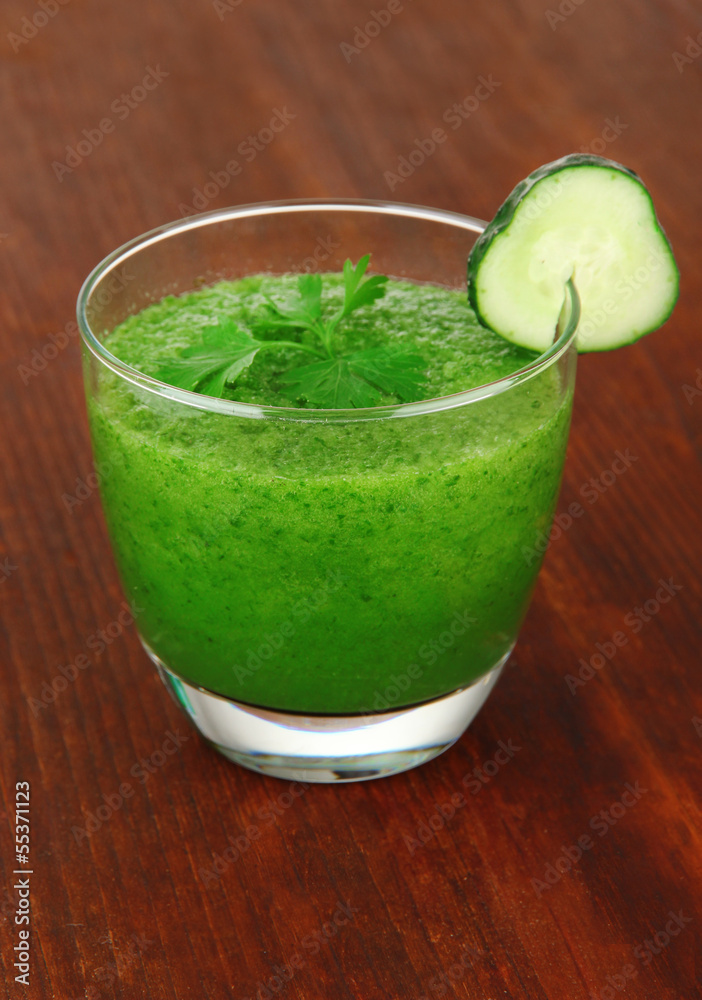 Green vegetable juice on table close-up Green vegetable juice on table close-up