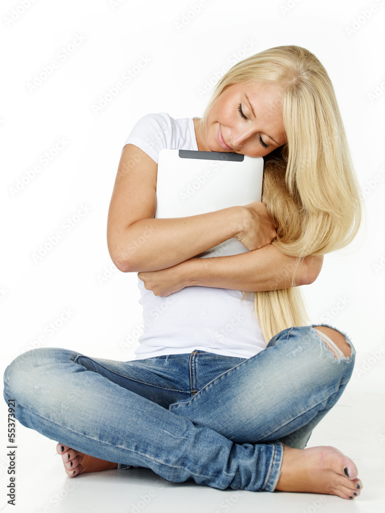 Pretty blond girl loves her touchpad so much Pretty blond girl loves her touchpad so much