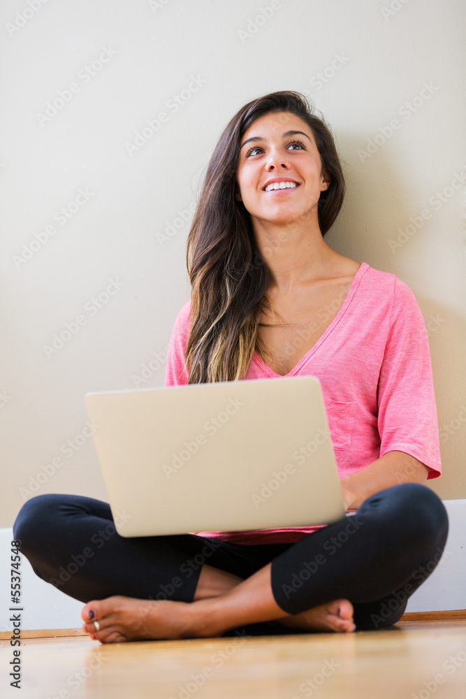 happy young woman using a laptop computer happy young woman using a laptop computer