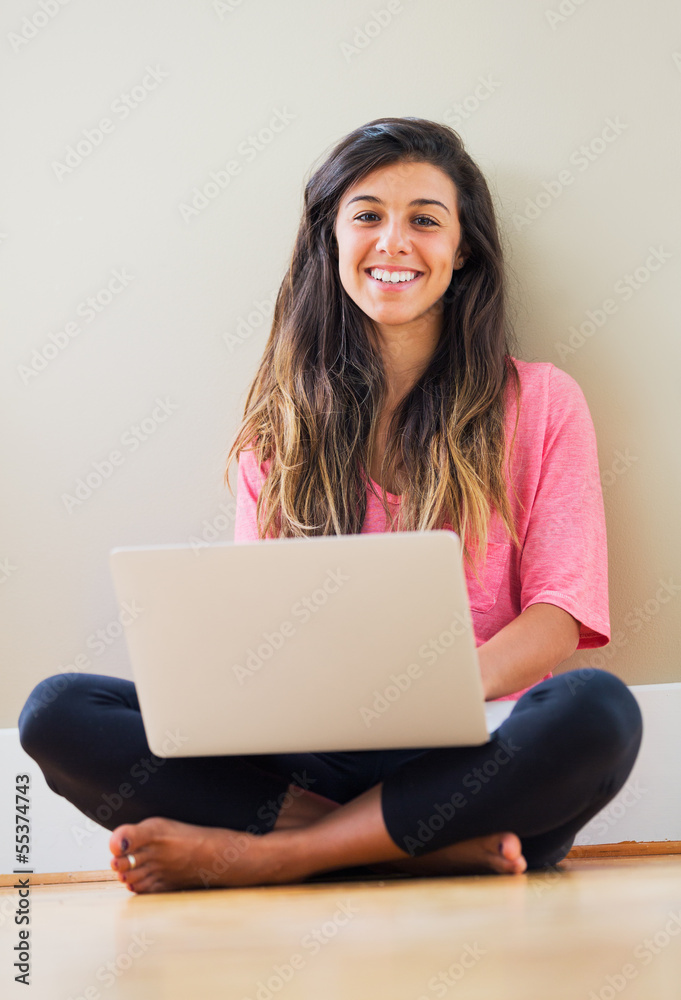 happy young woman using a laptop computer