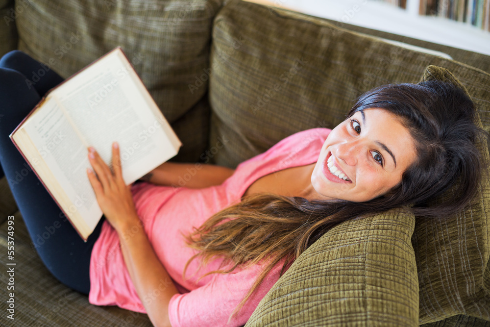 happy young woman reading a book happy young woman reading a book