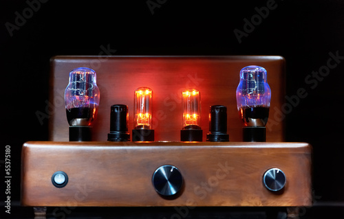 electronic amplifier with glowing bulb lamp photo