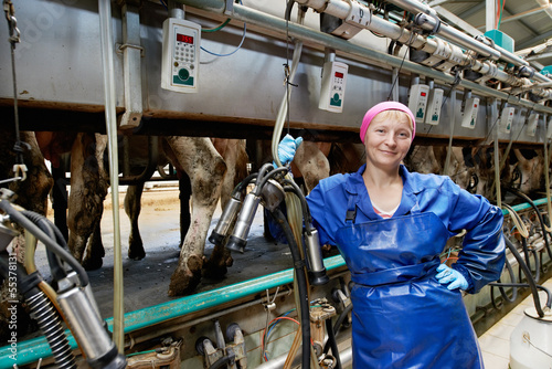 dairymaid at milking system farm