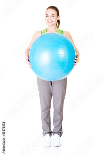 Healthy lifestyle woman with pilates exercise ball.