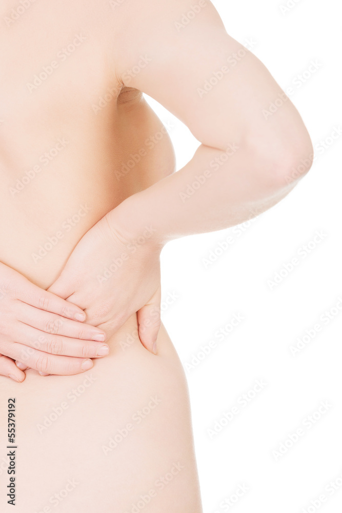 Young woman with pain in her back.