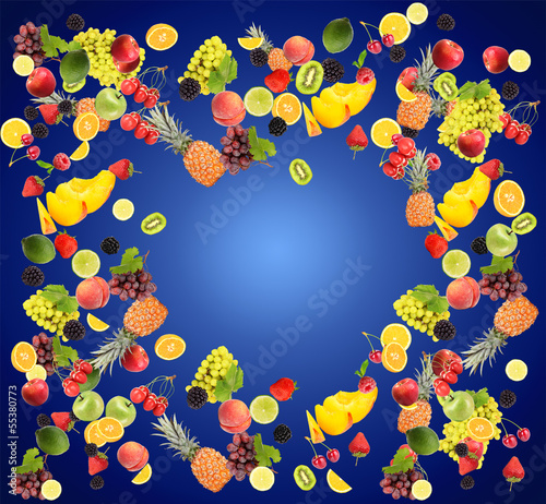 Different fruits and berries on blue background