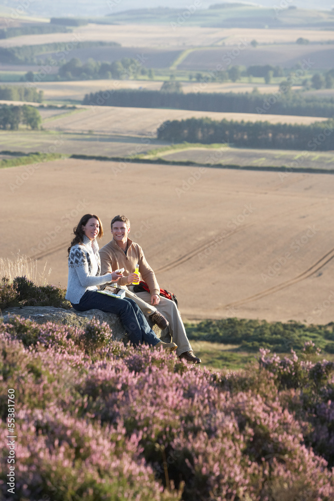 Fototapeta premium Couple Stopping For Lunch On Countryside Walk
