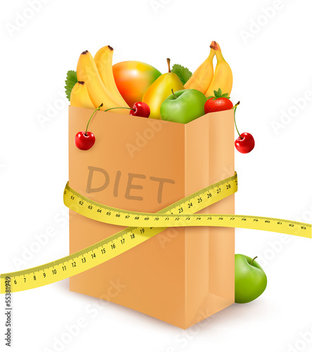 Fresh vegetables in a paper grocery bag with measuring tape. Con