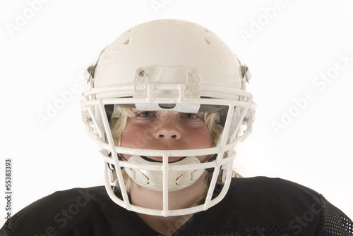 Boy in American football helmet