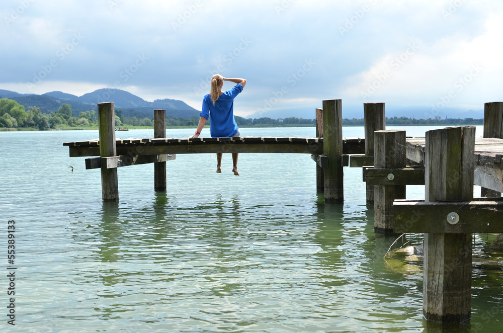 Girl on the wooden jetty. Switzerland Girl on the wooden jetty. Switzerland