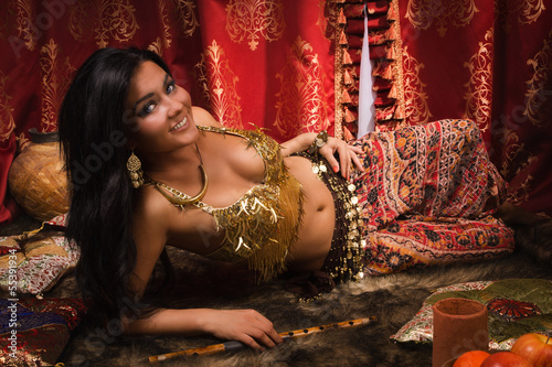 Beautiful woman in the arabic harem interior photo