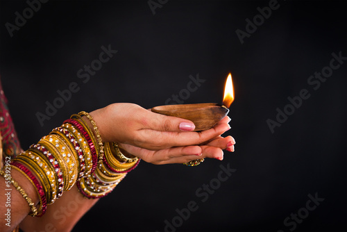 hand holding lantern during diwali festival of lights