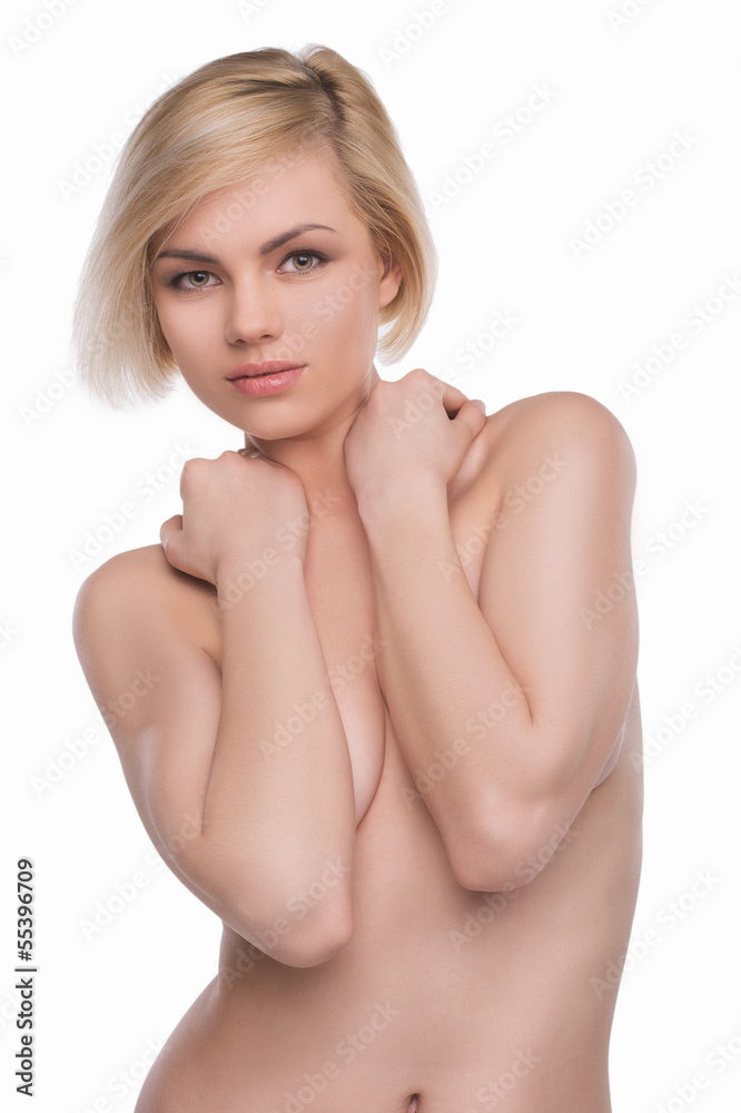 Obraz premium Beautiful blond woman. Beautiful shirtless woman covering breast
