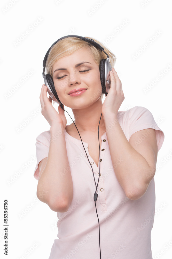 Woman in headphones. Beautiful young blond hair woman in headpho Woman in headphones. Beautiful young blond hair woman in headpho