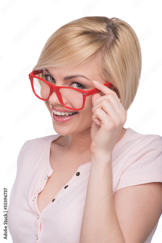 Woman in glasses. Cheerful young blond hair woman adjusting her