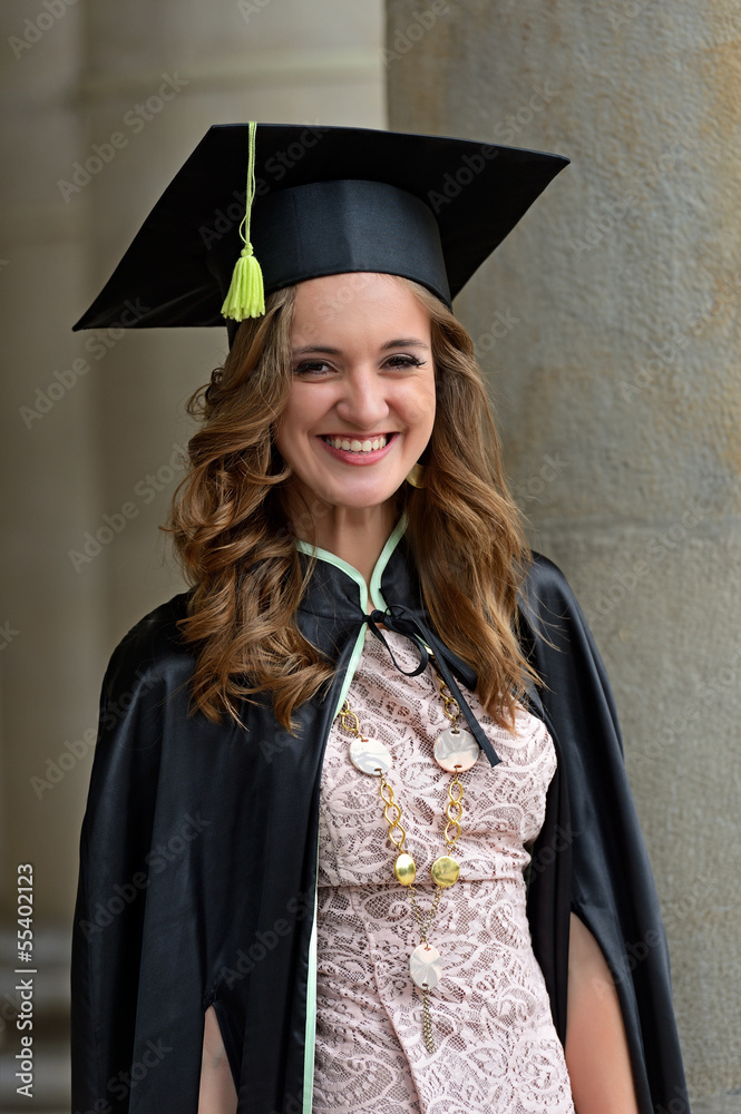 A university graduate in robes A university graduate in robes