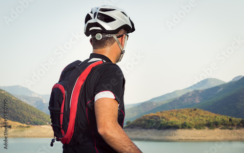 Mountain biker beside a beautiful lake