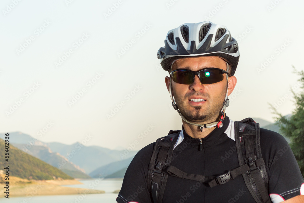 Mountain biker beside a beautiful lake