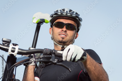 Mountain biker beside a beautiful lake
