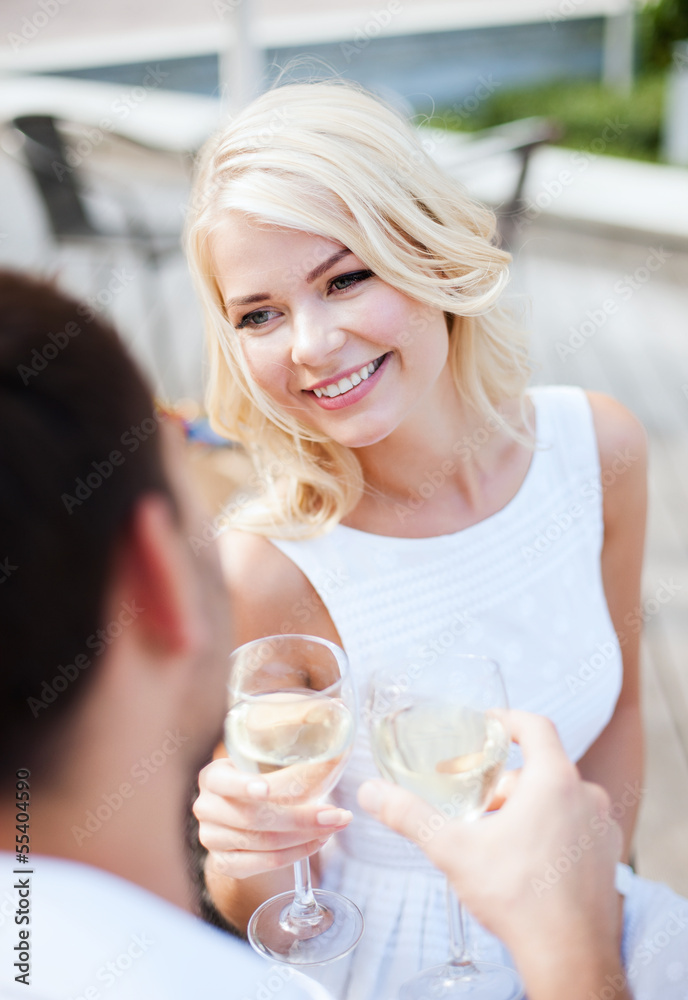 couple drinking wine in cafe couple drinking wine in cafe