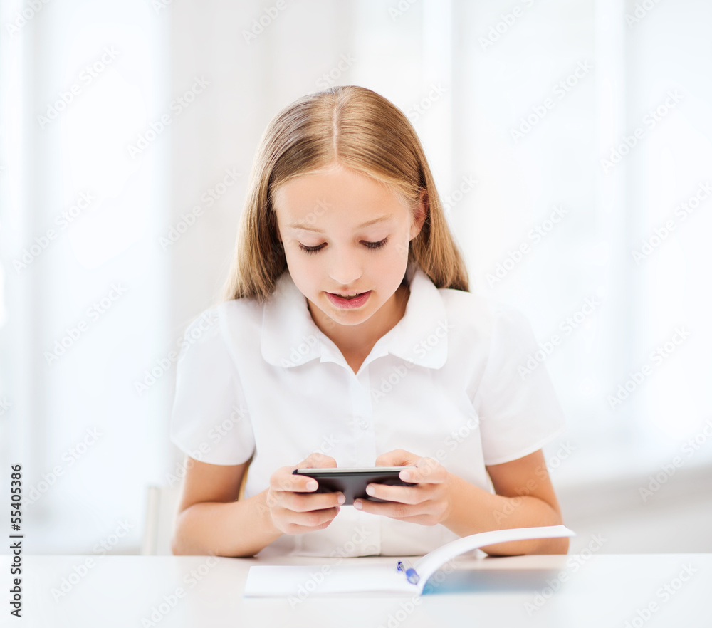 girl with smartphone at school girl with smartphone at school