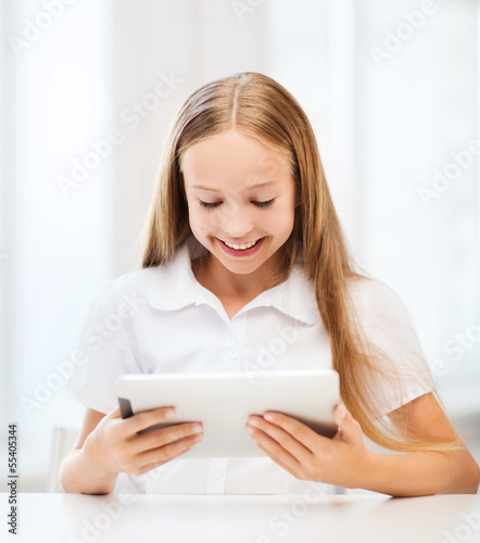 girl with tablet pc at school