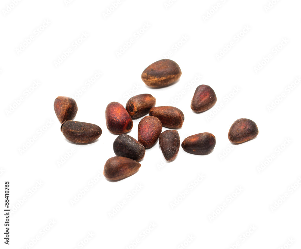 Pine nuts on a white background. macro Pine nuts on a white background. macro