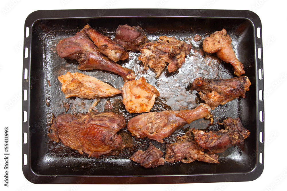 roasted chicken on a baking sheet on a white background