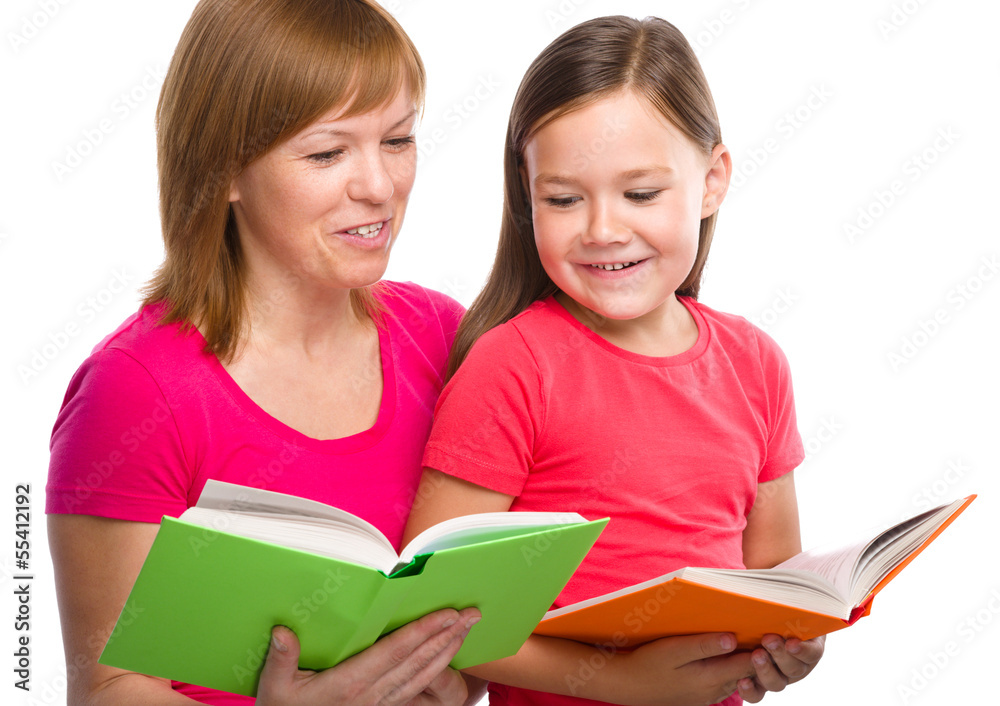 Mother and her daughter are reading books Mother and her daughter are reading books