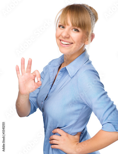 Woman is showing OK sign photo