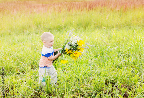 cute little boy with bouquet