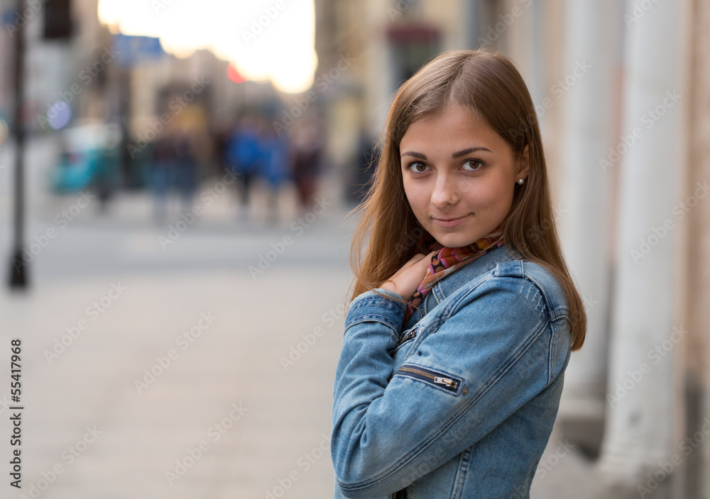 portrait of a beautiful girl in a jeans jacket