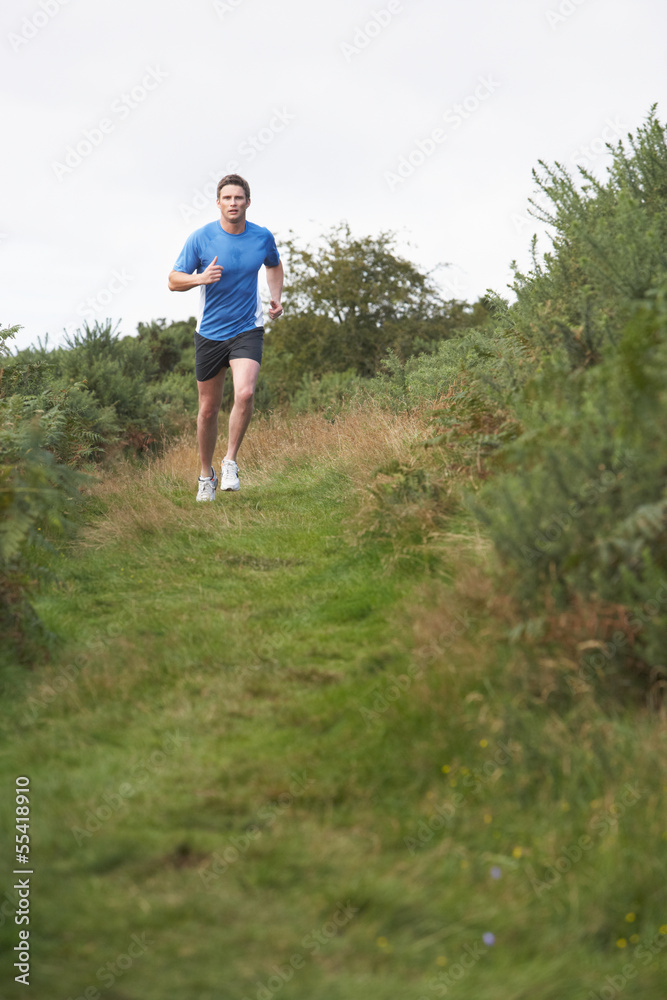 Naklejka premium Man On Run In Countryside