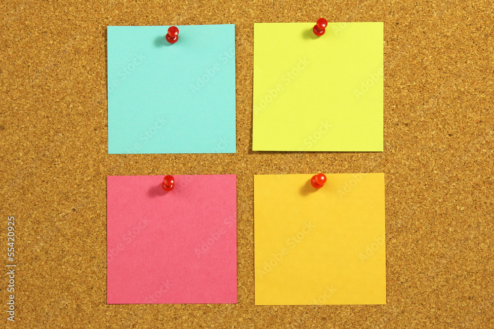 four blank note card on a cork board four blank note card on a cork board
