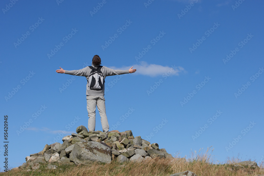 Male Walker Standing On Pile Of Rocks Male Walker Standing On Pile Of Rocks