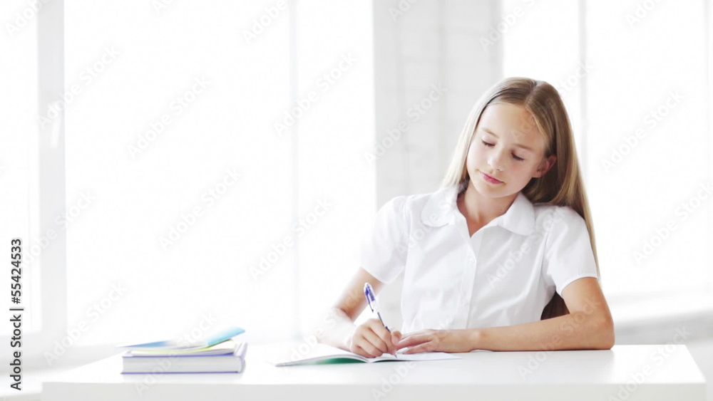 happy student girl making homework