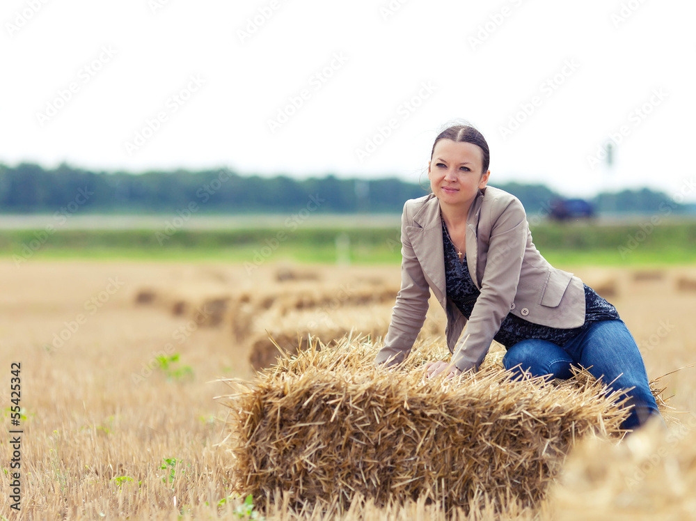 portrait of nice girl with a straw on a field portrait of nice girl with a straw on a field