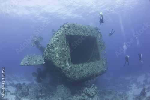Scuba divers exploring a shipwreck