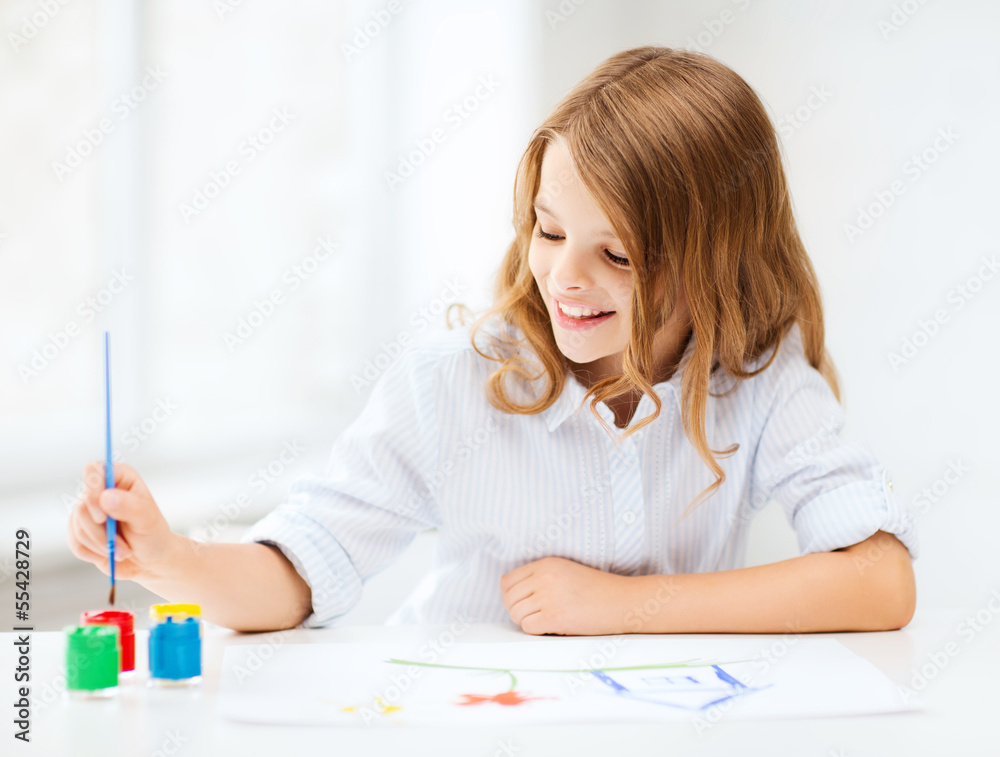 little girl painting at school little girl painting at school