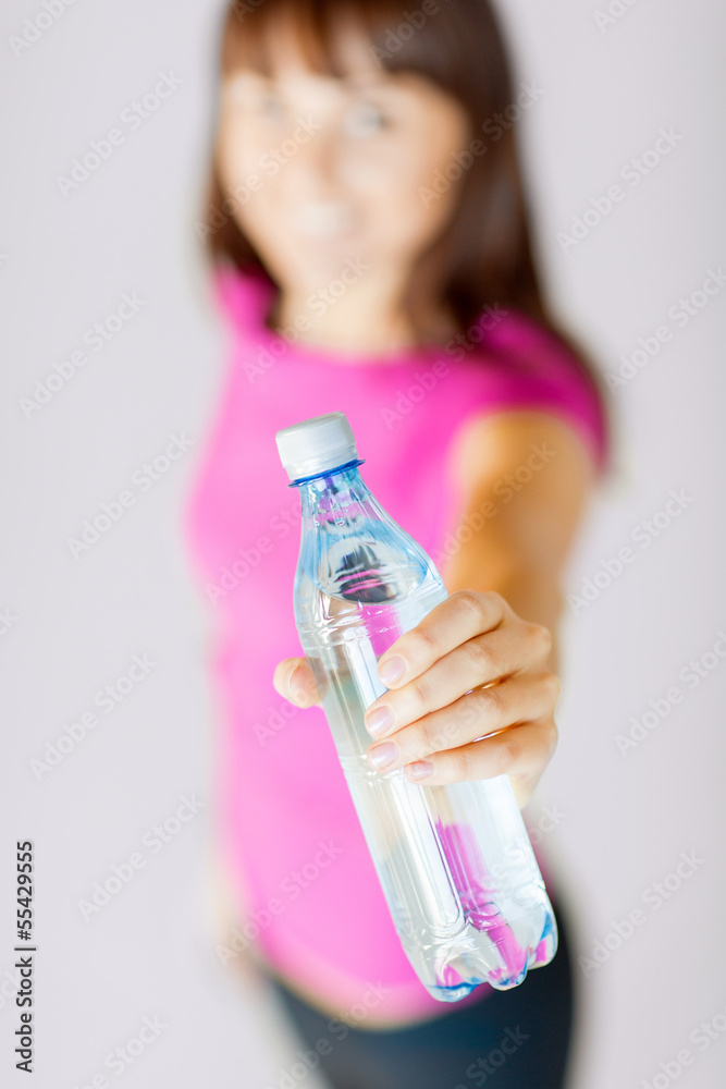 sporty woman with bottle of water
