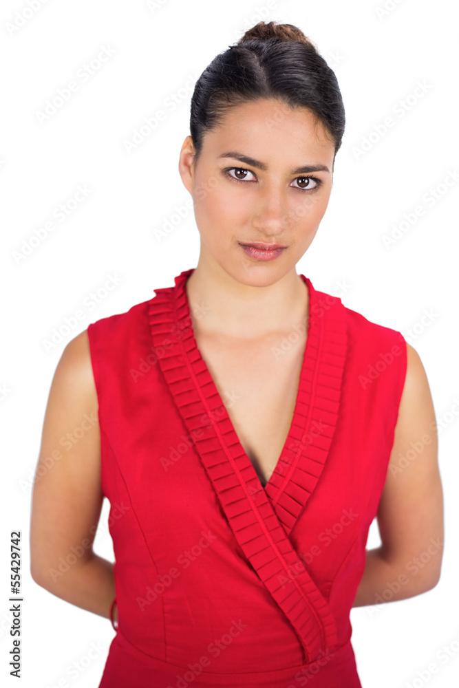 Contemplative sexy brunette in red dress posing Contemplative sexy brunette in red dress posing