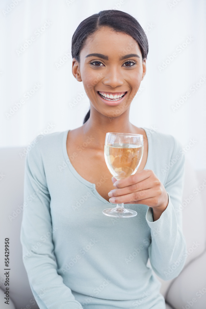 Cheerful attractive woman drinking white wine Cheerful attractive woman drinking white wine